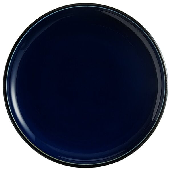An Acopa Azora blue porcelain coupe plate with a black rim.