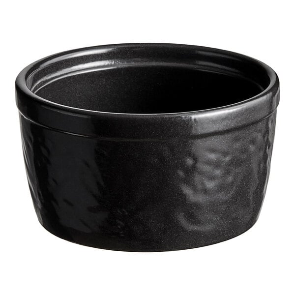 A black Acopa Keystone porcelain ramekin with a textured surface.
