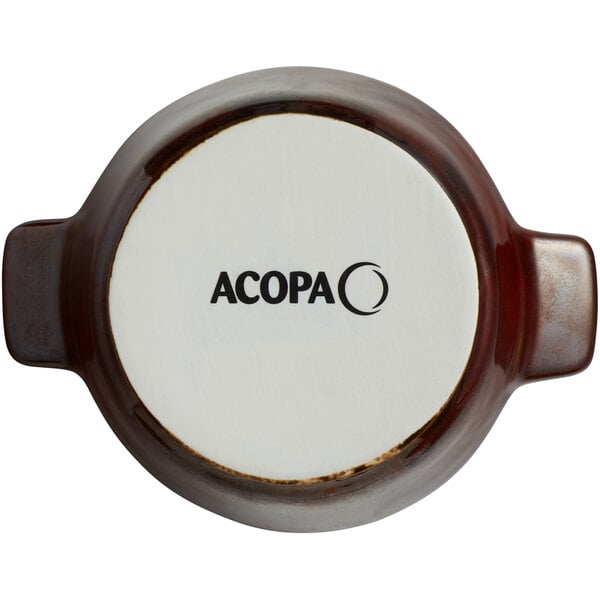 A brown and white Acopa porcelain mini casserole dish with handles.