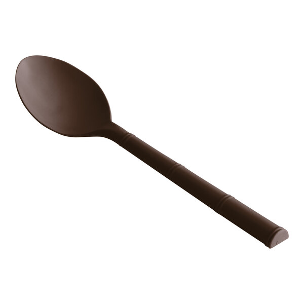 A close-up of a brown polycarbonate soup spoon with a handle.