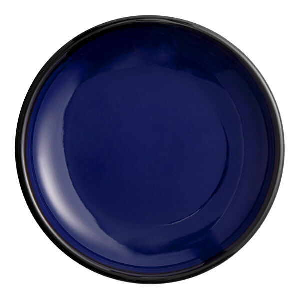 An Acopa Keystone Azora blue porcelain plate with a circular edge and black rim.