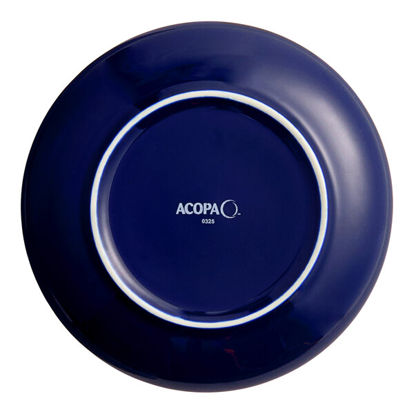 An Acopa Keystone Azora blue porcelain coupe plate with white text on it.