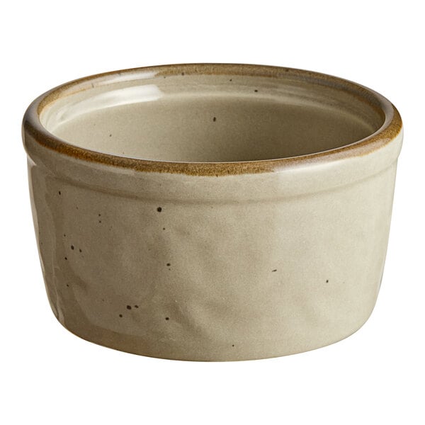 A close up of a granite gray Acopa Keystone porcelain ramekin with brown speckles.