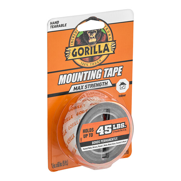 A package of Gorilla Max Strength Mounting Tape with a roll of black tape inside.