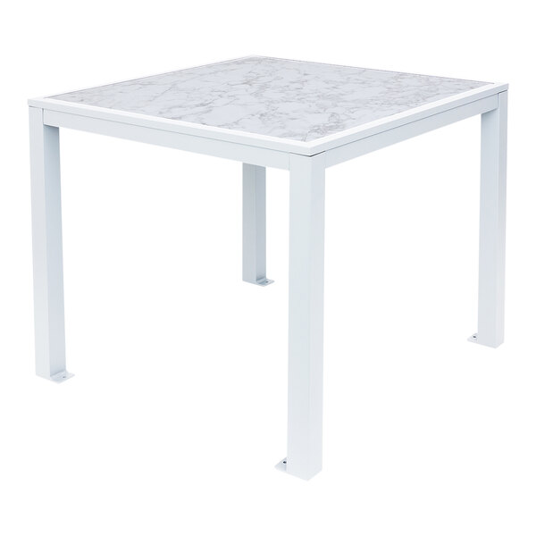 A white table with a white marble top.