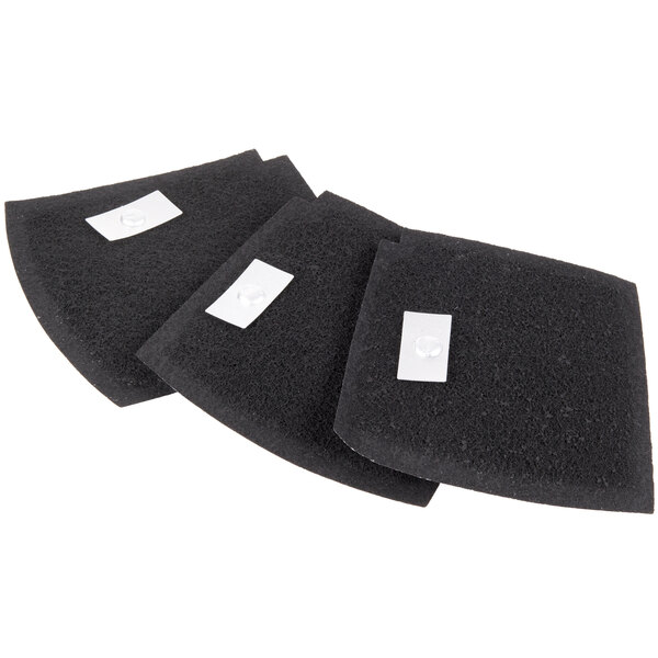 Three black pads with white labels on them.