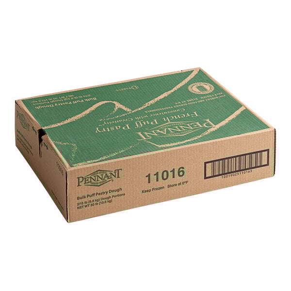 A cardboard box containing Pennant French puff pastry dough sheets, weighing 15 pounds per bag with two bags per case.