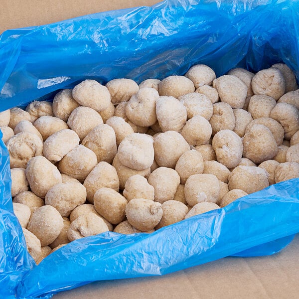 A blue bag of Pennant Parker House style wheat dinner rolls.
