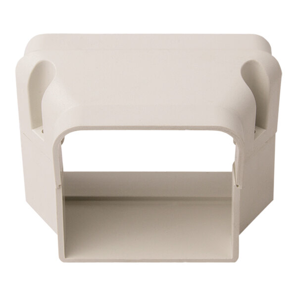 A white rectangular plastic object with holes.