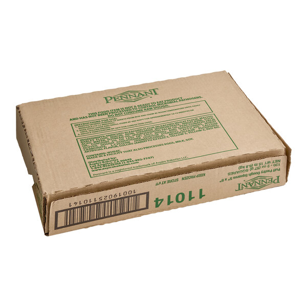 A cardboard box containing Pennant French puff pastry dough sheets.