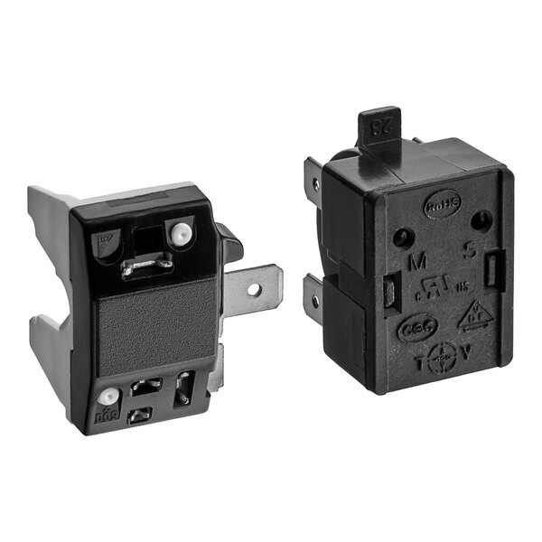 A black electrical box with two white switches.