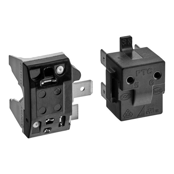 A black electrical box with two switches, one on top.