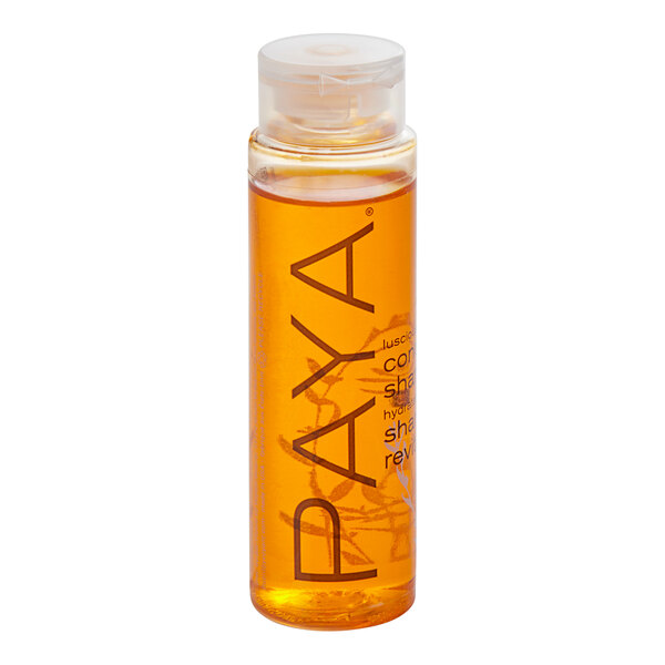 A close up of a small yellow bottle of PAYA Papaya Conditioning Shampoo.