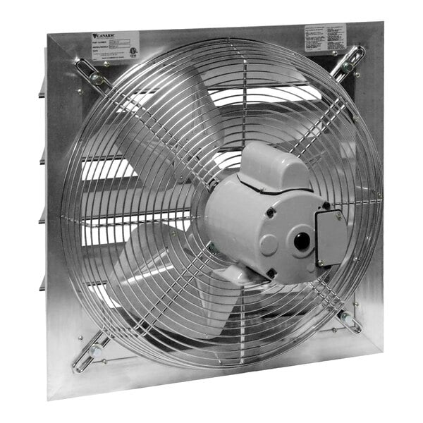 A square, metal shutter-mounted exhaust fan with a protective wire grille and three blades, designed for industrial or commercial ventilation.