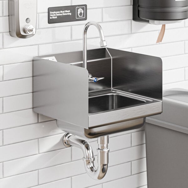 A Regency wall-mounted hand sink with a T&S faucet and side splash.