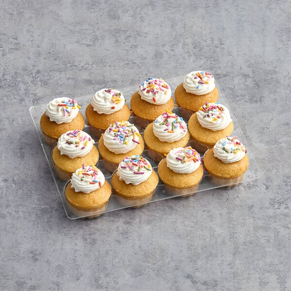 A tray of Abe's Vegan Vanilla cupcakes with frosting and sprinkles.