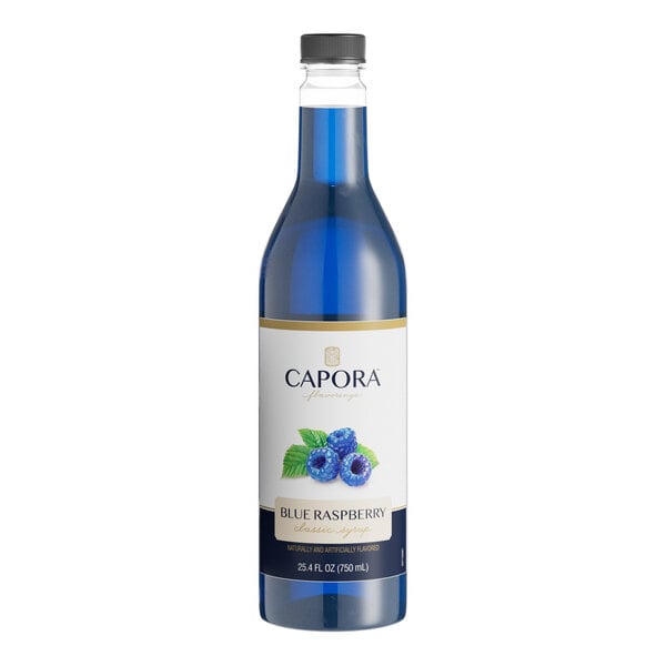 A bottle of Capora Blue Raspberry flavoring syrup with blue liquid inside.