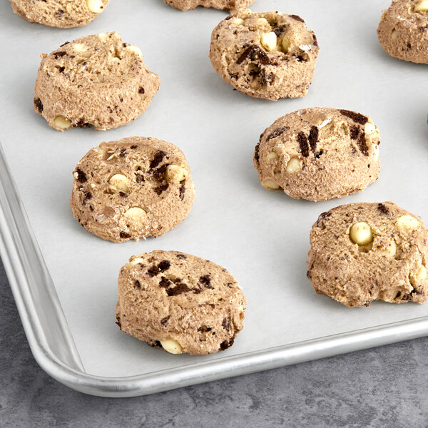 A tray of David's Cookies and Cream cookie dough on a baking sheet.