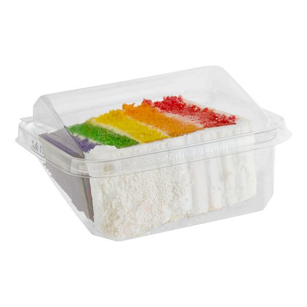 A plastic container with a slice of David's Cookies rainbow cake inside.