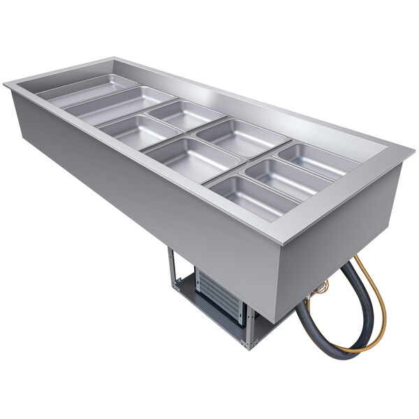 A Hatco slanted drop-in refrigerated cold food well with trays inside.