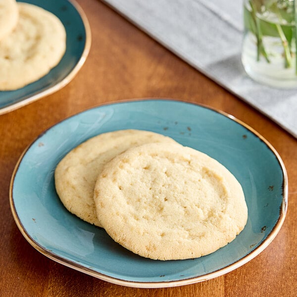 Two David's Cookies sugar cookies on a blue plate.