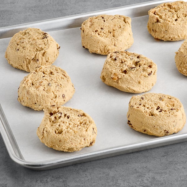 Preformed David's Cookies Decadent Salted Caramel cookie dough on a baking sheet.
