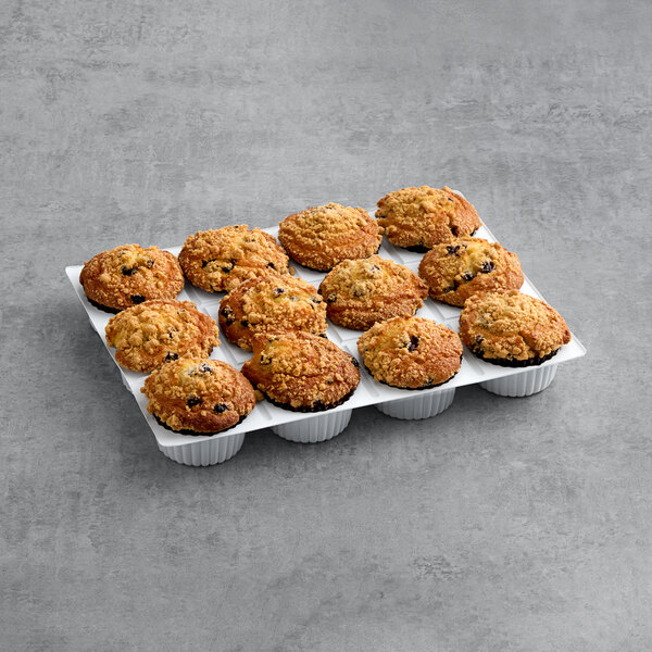 A tray of David's Cookies Blueberry Crumb Muffins on a gray surface.