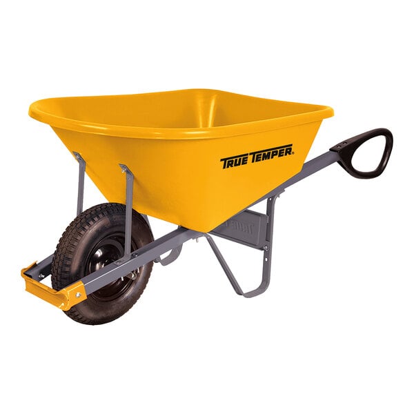 A yellow True Temper wheelbarrow with black handles.