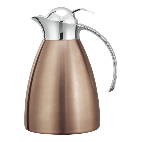 A rose gold stainless steel carafe with a handle and push button lid.