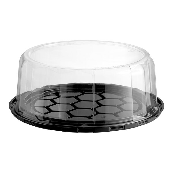 A Baker's Lane plastic cake container with a clear scalloped dome lid.