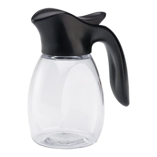 A clear plastic syrup dispenser with a black top and handle.