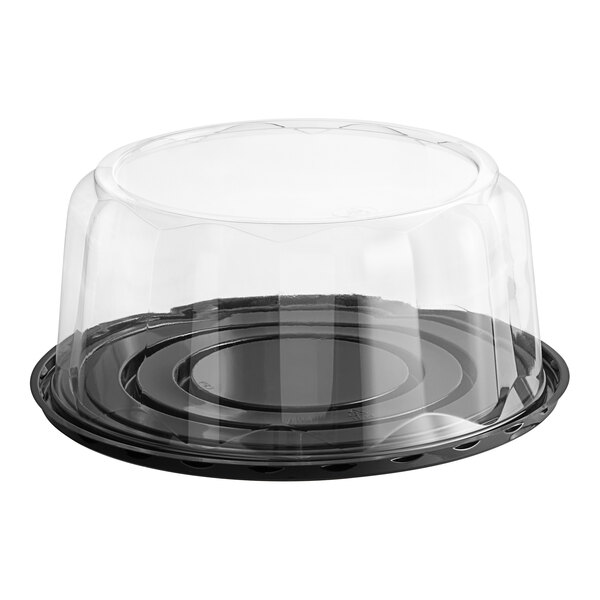A Baker's Lane plastic cake container with a clear scalloped dome lid.