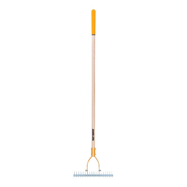 A thatch rake with a hardwood handle and a yellow cushion end grip.