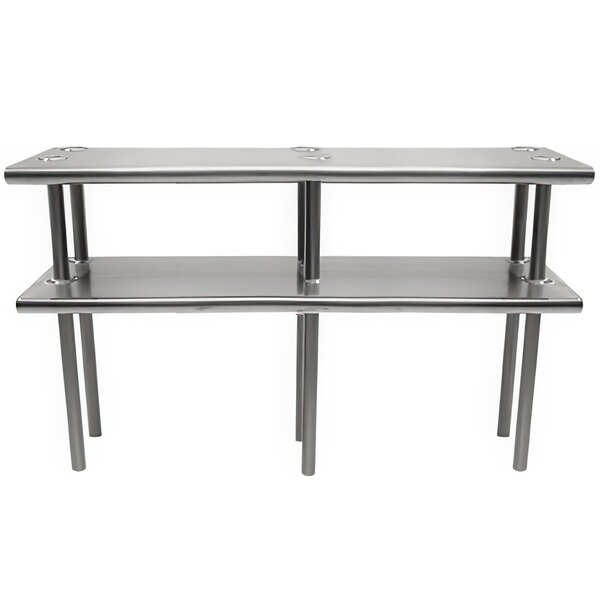 A stainless steel Advance Tabco double deck overshelf with metal legs holding two shelves.