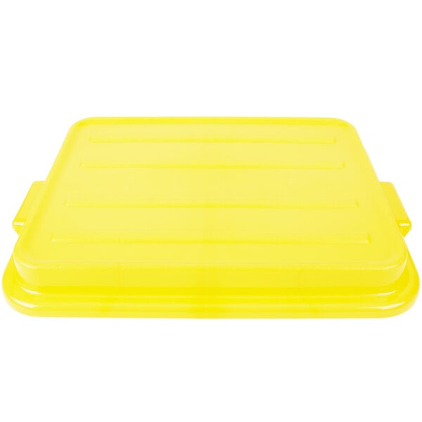 A yellow Vollrath Traex Color-Mate lid on a yellow rectangular container.