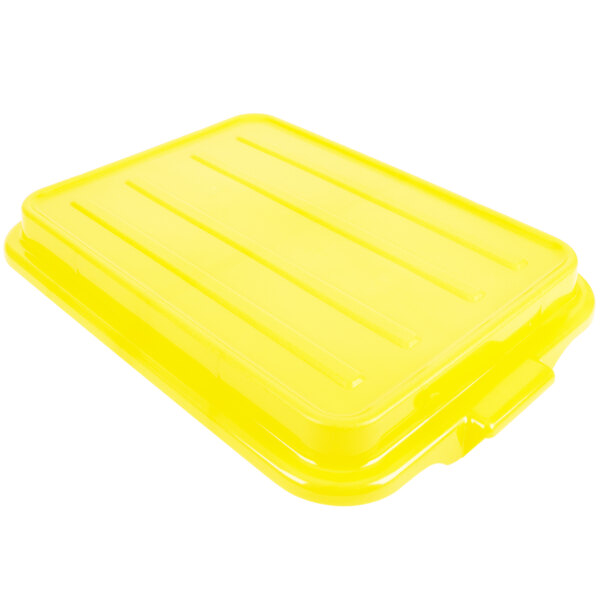 A yellow Vollrath Traex Color-Mate lid on a yellow plastic container.
