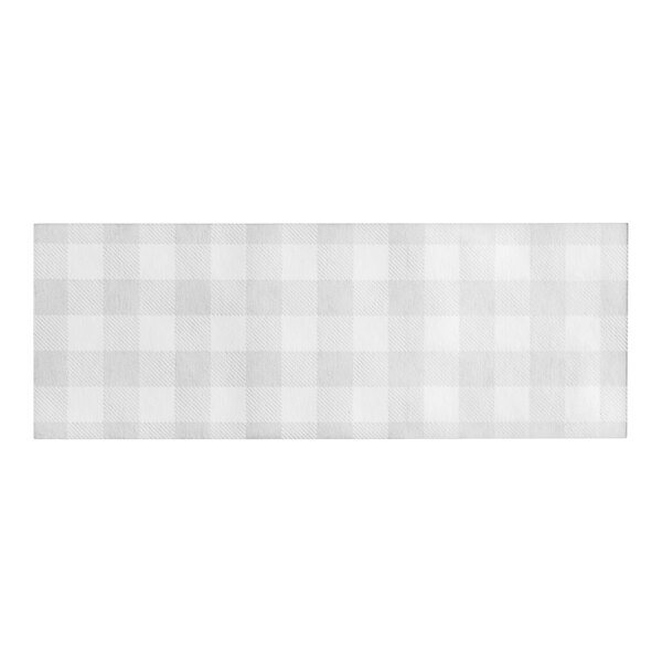 A white and grey checkered fabric with Choice black gingham paper napkin bands on top.