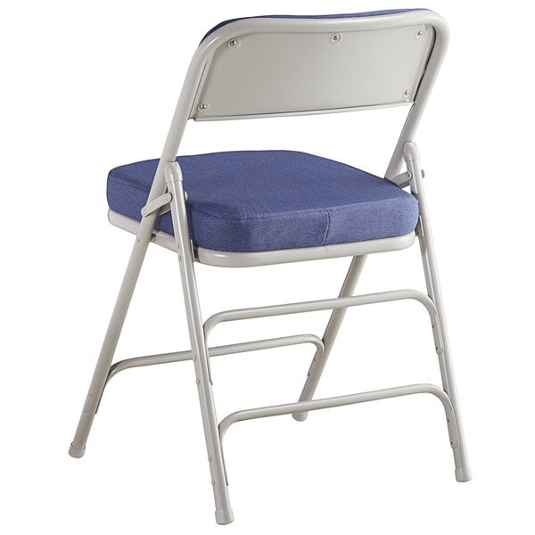 A blue Lancaster Table & Seating folding chair with a padded seat and backrest.