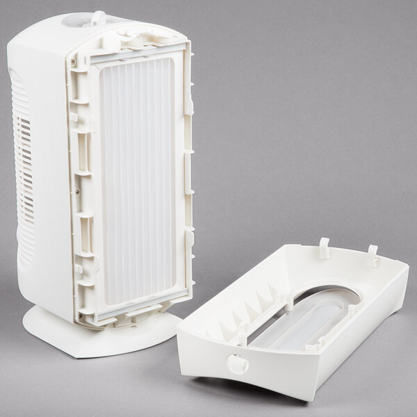 A white Hamilton Beach air purifier with a plastic lid open.