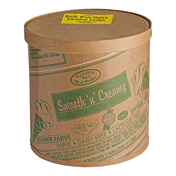A round brown Klein's Real Kosher Vegan Caramel Fudge Ice Cream container with a lid and green and white text.