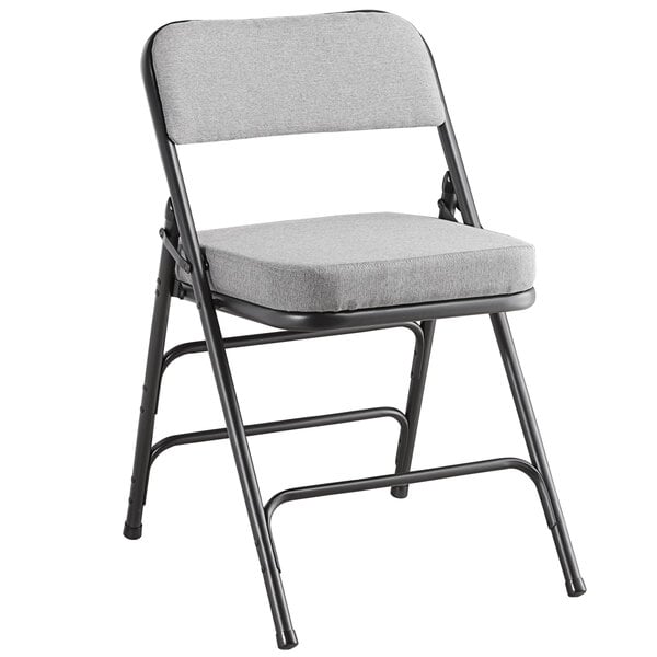 A Lancaster Table & Seating gray fabric folding chair with a 2" padded seat and black metal frame.