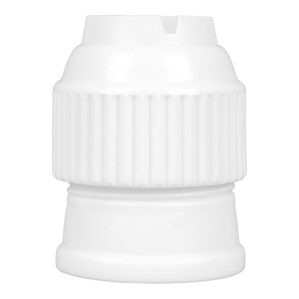 A white, ribbed, cylindrical plastic object with a slot at the top, resembling a connector or coupler.