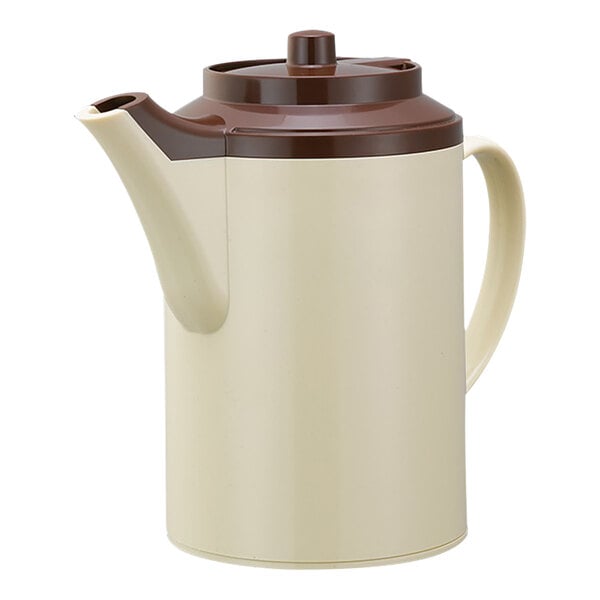 A beige and brown stoneware teapot with a lid.