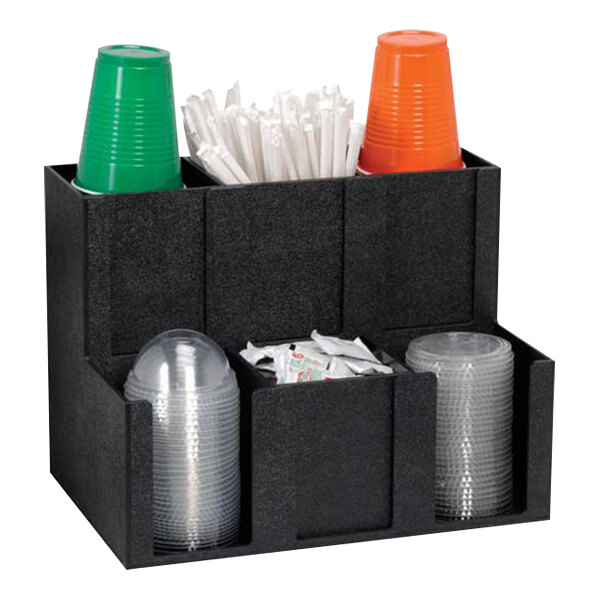 A black Dispense-Rite countertop organizer with cups and lids in it.