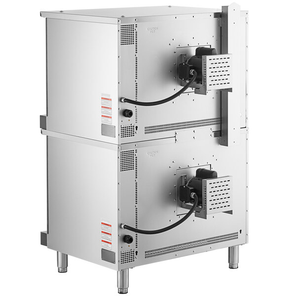 A double deck electric full size convection oven with legs, made of stainless steel and equipped with control panels and power cords on the back.