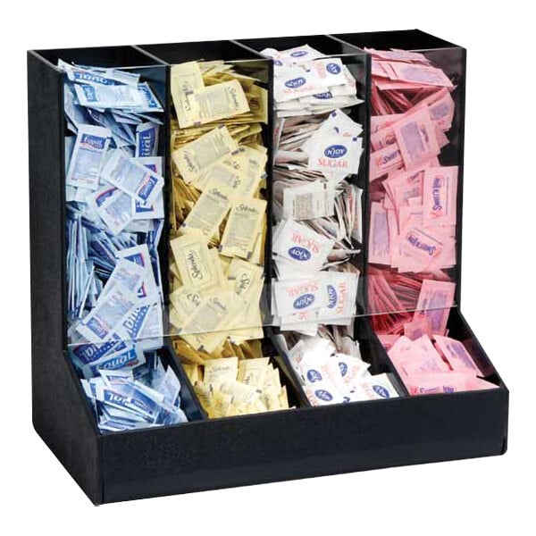 A black Dispense-Rite countertop condiment organizer with different colored sugar packets.