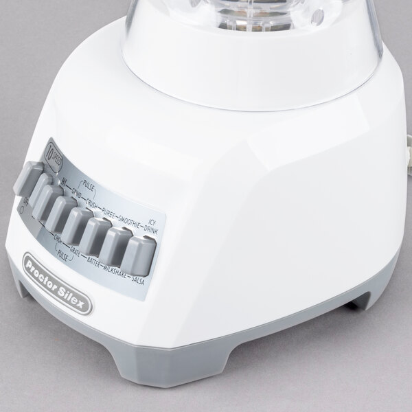 A white and silver Proctor Silex blender.