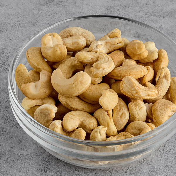 A bowl of large raw cashews.