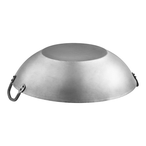 A silver Emperor's Select carbon steel wok with handles.