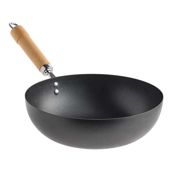 A 12-inch carbon steel non-stick flat bottom wok with a wooden handle.